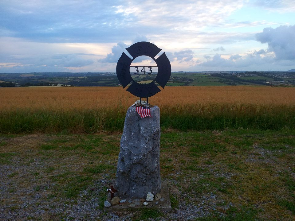 A photo of a monument to the 343 firefighters killed in 9/11, with the number 343 in metal at the center of a round sculpture.